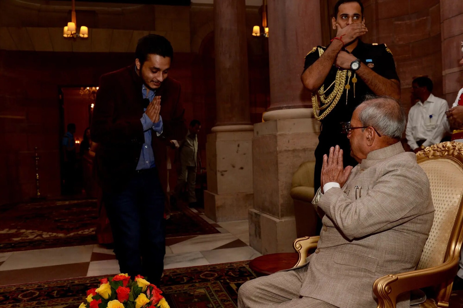 Nitish Jindal and Pranab Mukherjee exchanging a folded-hands greeting.